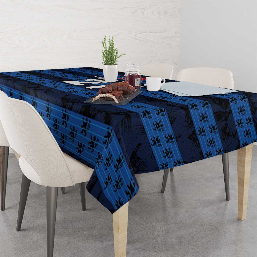 Blue tablecloth with dark motif pattern and matching corner drape over table