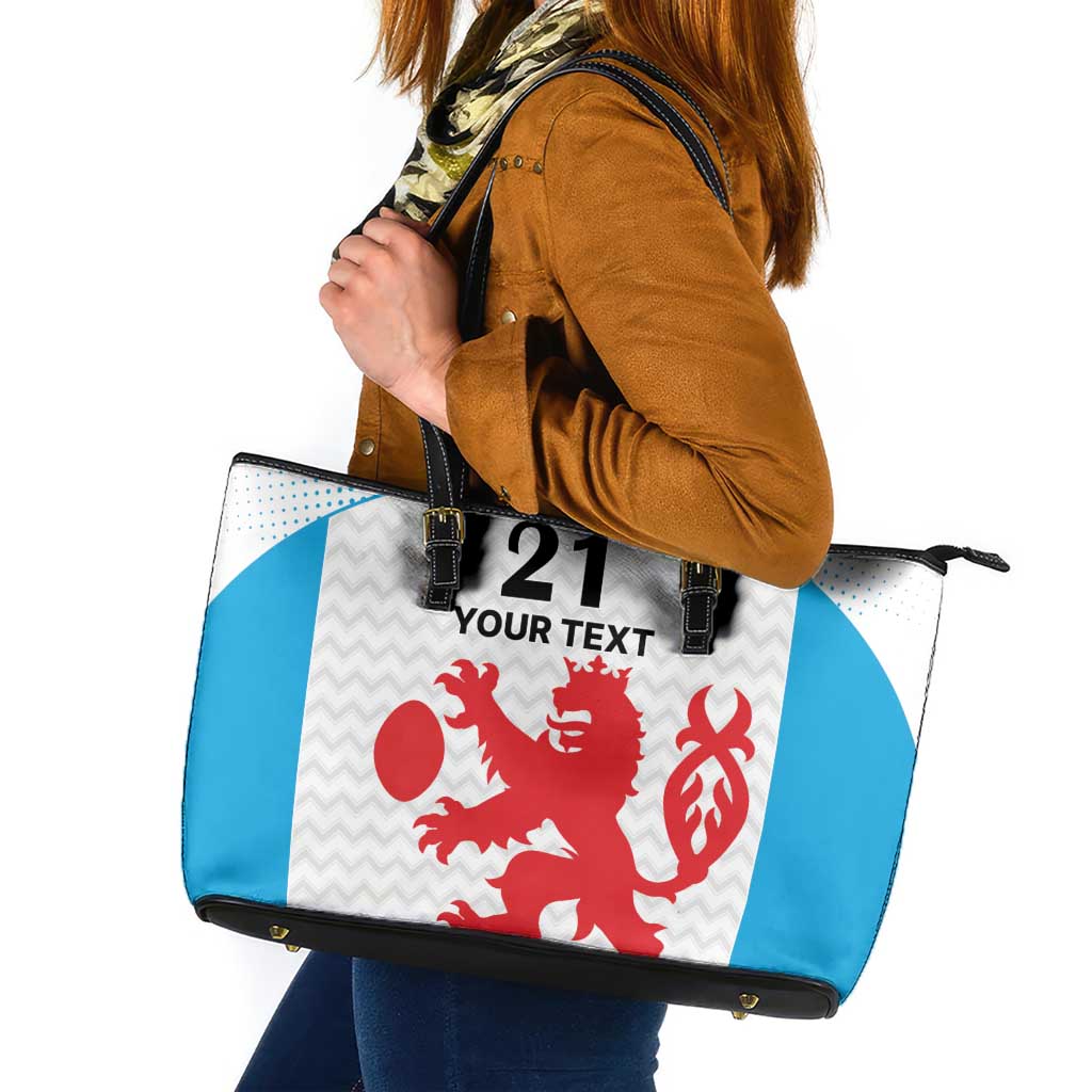 Leather tote bag with black handles; white/blue panels and red sports motifs, with '21' and 'Your Text'.