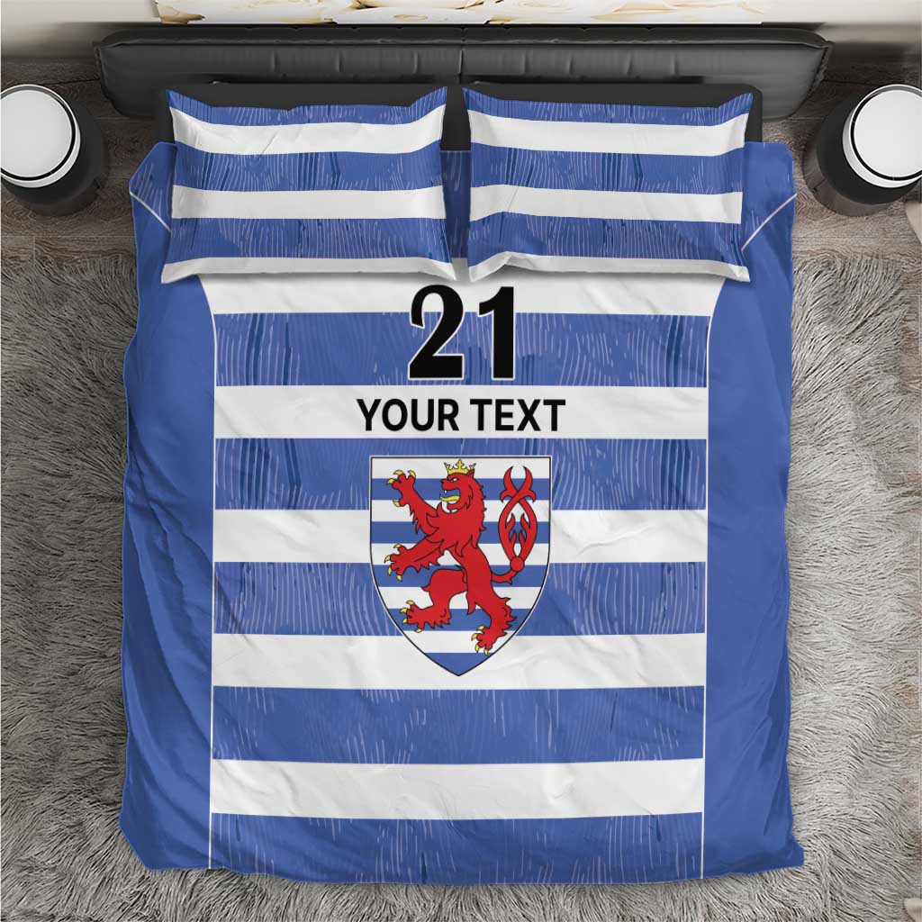 Blue and white striped bedding set with crest, number 21, and “YOUR TEXT” panel