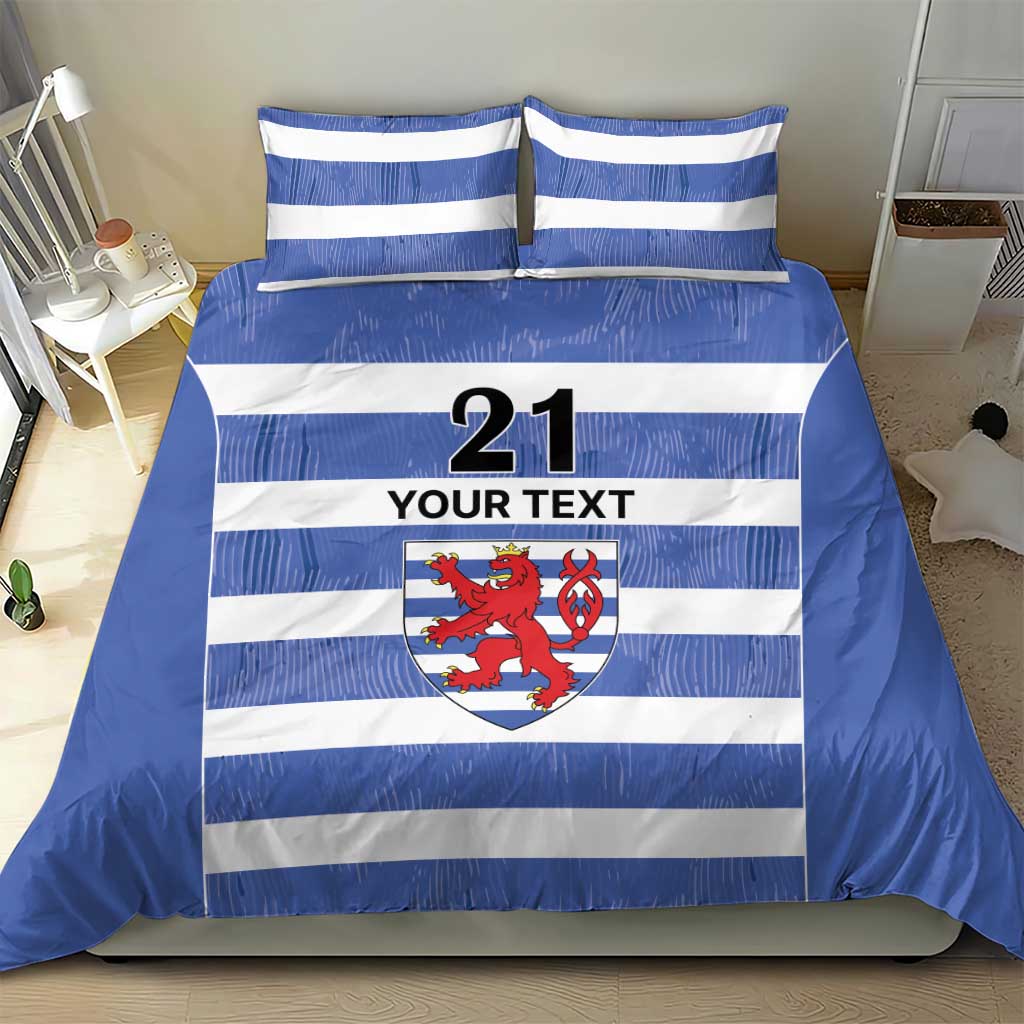 Blue and white striped duvet and pillow set with crest emblem, number 21, and “YOUR TEXT”