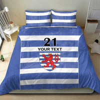 Blue and white striped duvet and pillow set with crest emblem, number 21, and “YOUR TEXT”