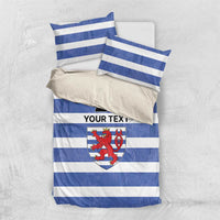 Blue and white striped bedding set with crest, number 21, and “YOUR TEXT” on duvet
