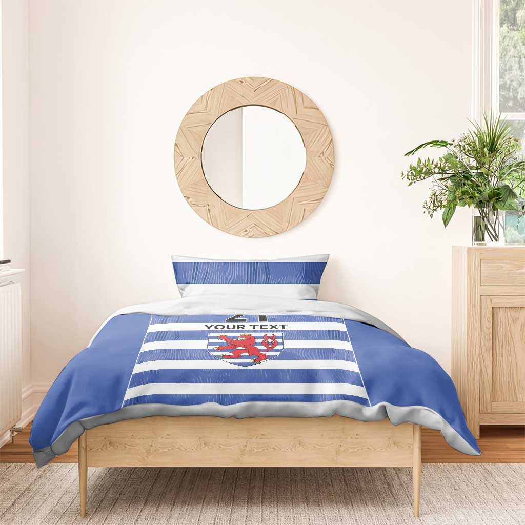Blue and white striped bedding set with crest emblem, number 21, and “YOUR TEXT”