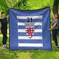 Large blue quilt spread out, with white stripes, number 21, custom text, lion crest