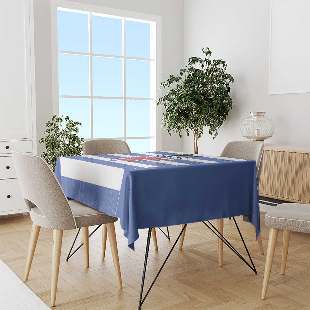 Rectangular blue tablecloth with horizontal stripes and central crest shield design