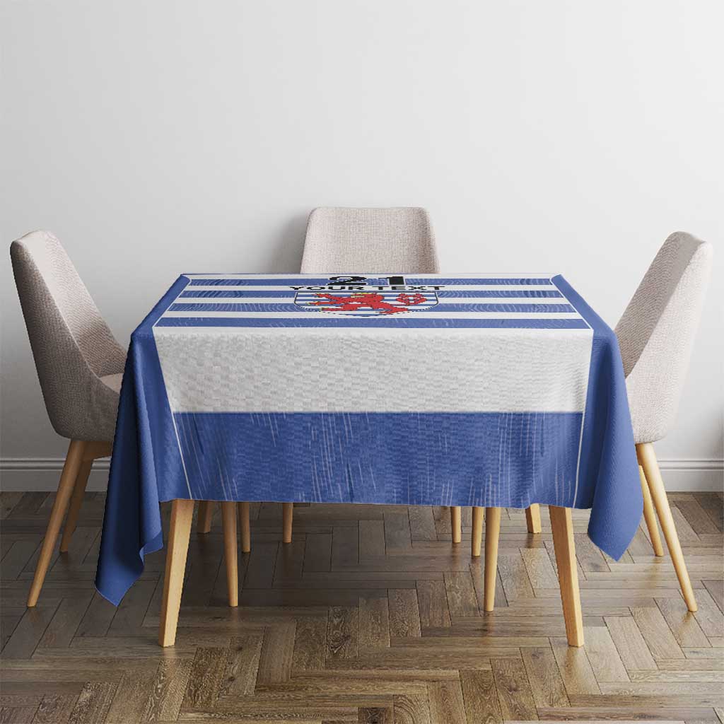 Blue tablecloth with striped rugby design and central crest shield panel