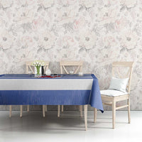 Blue tablecloth with rugby stripes and central crest panel on a dining table