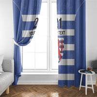 Blue and white striped curtains with red crest and custom text, gathered at a bright window.