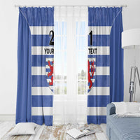 Blue and white striped curtains with red crest and custom text, set before a window with sheer light.