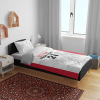 Rugby bedding set on bed: white duvet with red side panels, gray crest and 'YOUR TEXT 21'
