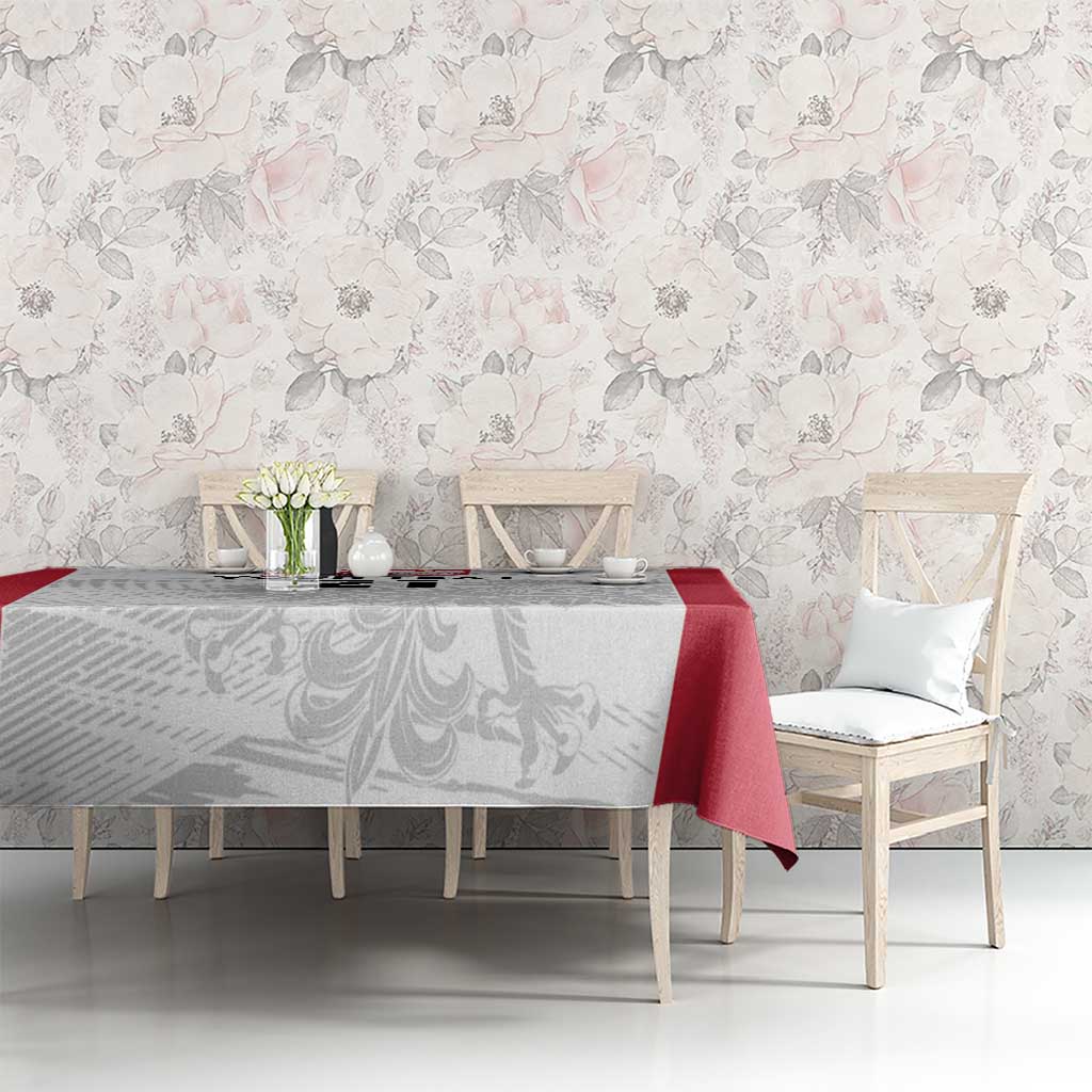 Rugby-themed tablecloth in white-gray with red panel, draped over dining table