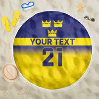 Round beach blanket with blue/yellow flag design, crowns, 'YOUR TEXT' and 21, fringe
