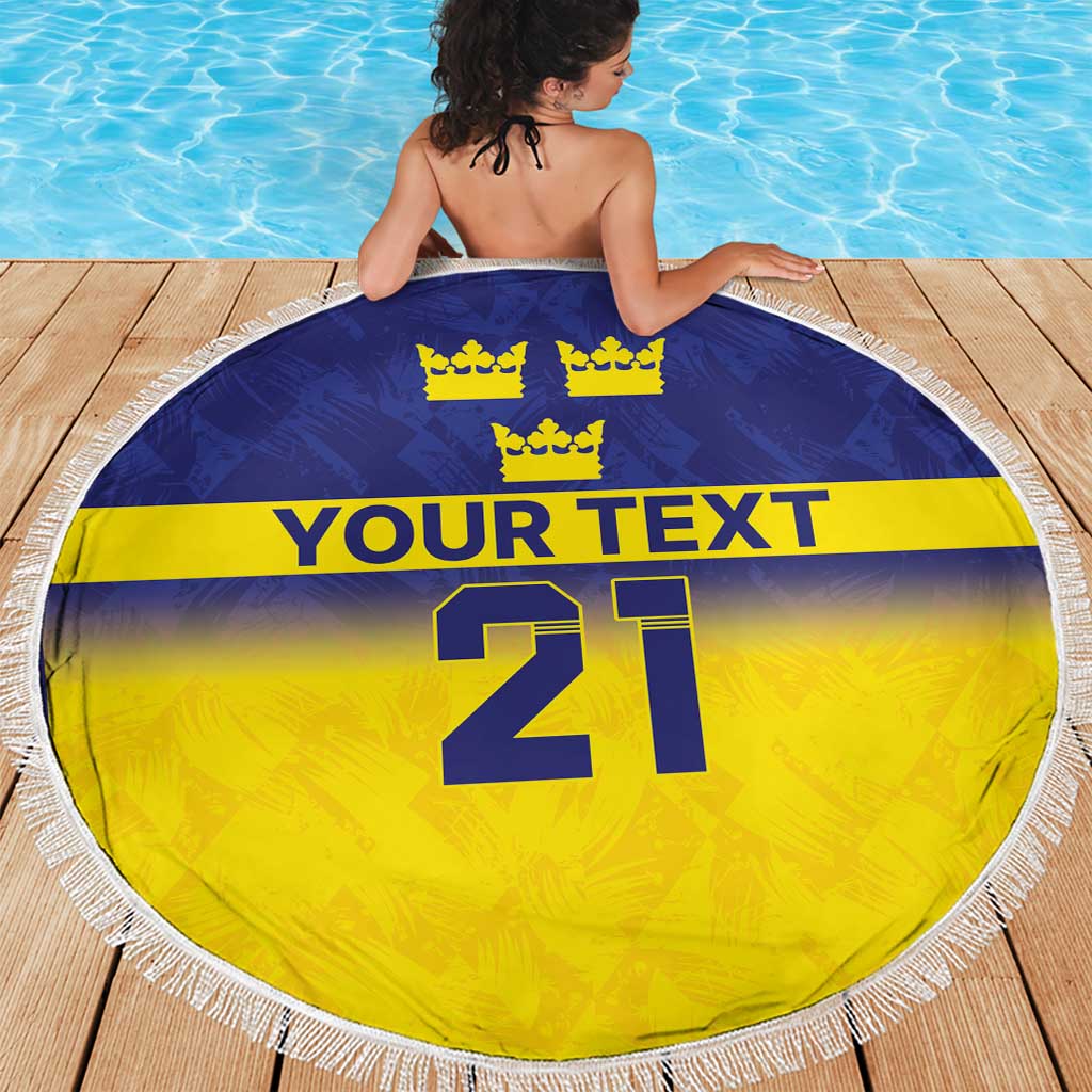 Round beach blanket with blue top, yellow bottom, crowns, 'YOUR TEXT' and 21, white fringe