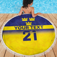 Round beach blanket with blue top, yellow bottom, crowns, 'YOUR TEXT' and 21, white fringe