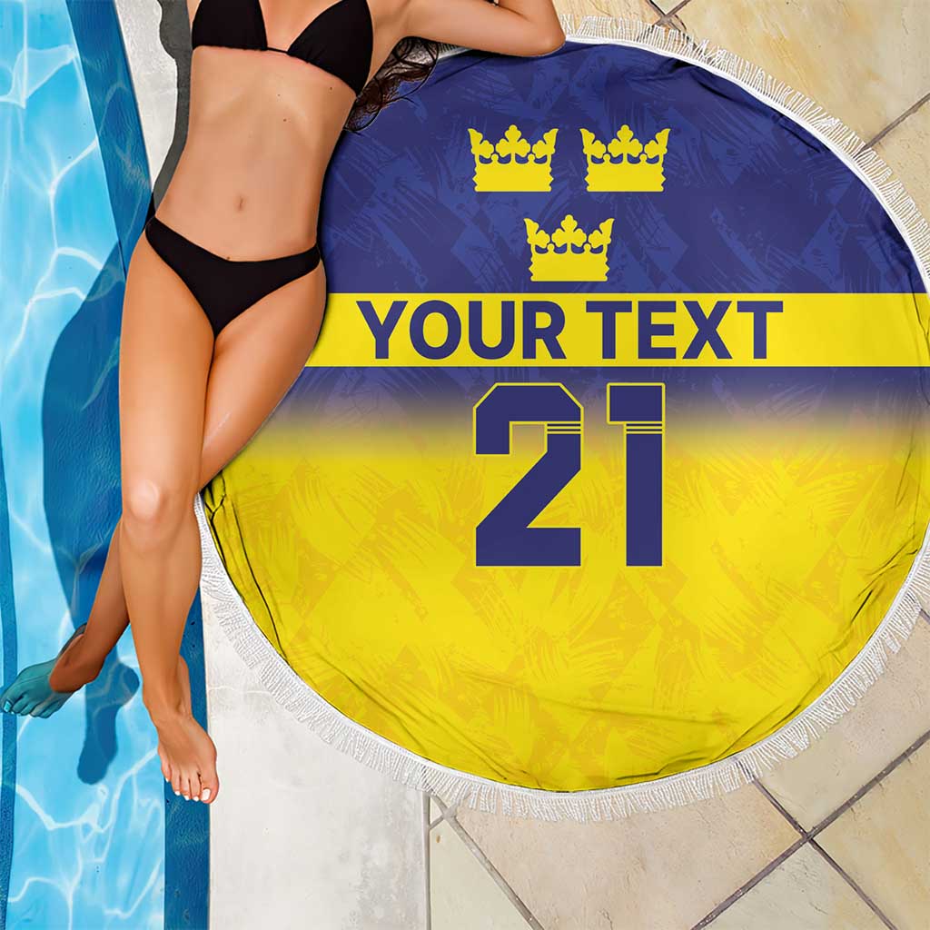 Round beach blanket with blue top, yellow bottom, crowns, 'YOUR TEXT' and 21, white fringe