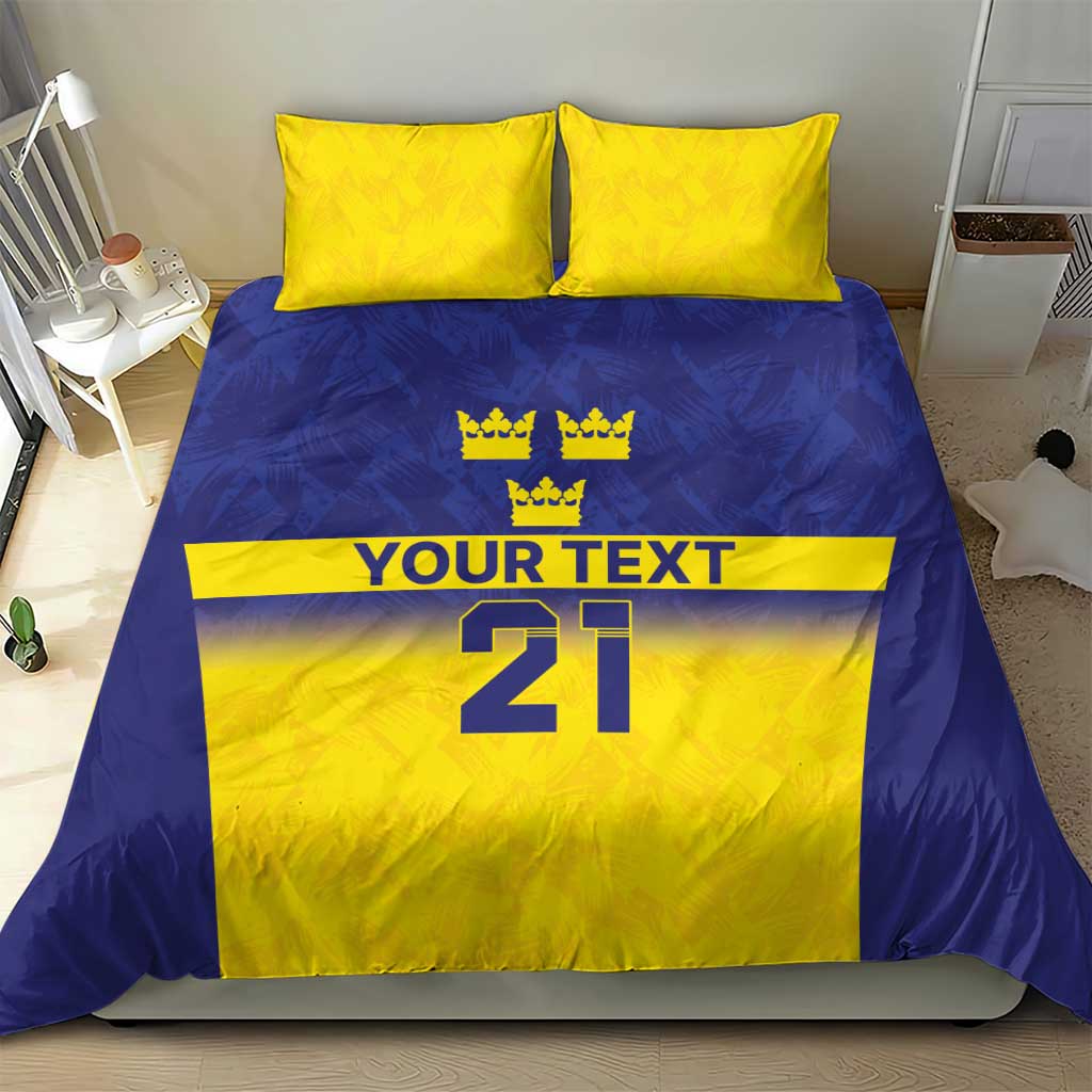 Blue and yellow duvet bedding set with crown icons above “YOUR TEXT” and “21” number