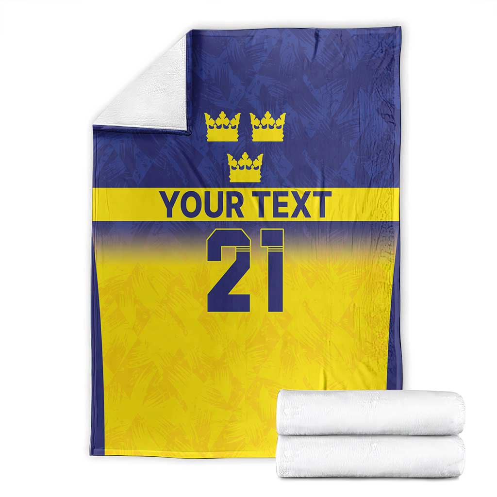 Folded custom rugby blanket, blue and yellow panels with crowns, “YOUR TEXT,” and number 21.
