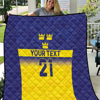 Blue and yellow Sweden-themed quilt with quilted diamonds, crowns, 'YOUR TEXT' and 21