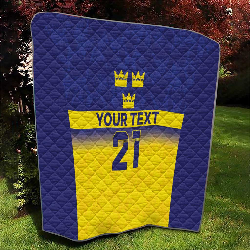 Blue and yellow Sweden-themed quilt with quilted pattern, crowns, 'YOUR TEXT' and 21