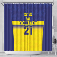 Blue shower curtain featuring three crown symbols above a yellow stripe and "21" design