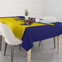 Rectangular blue and yellow tablecloth with crown stripe and graphic motif on dining table