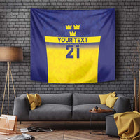 Blue wall tapestry with yellow panel, three crowns, “YOUR TEXT,” and number 21