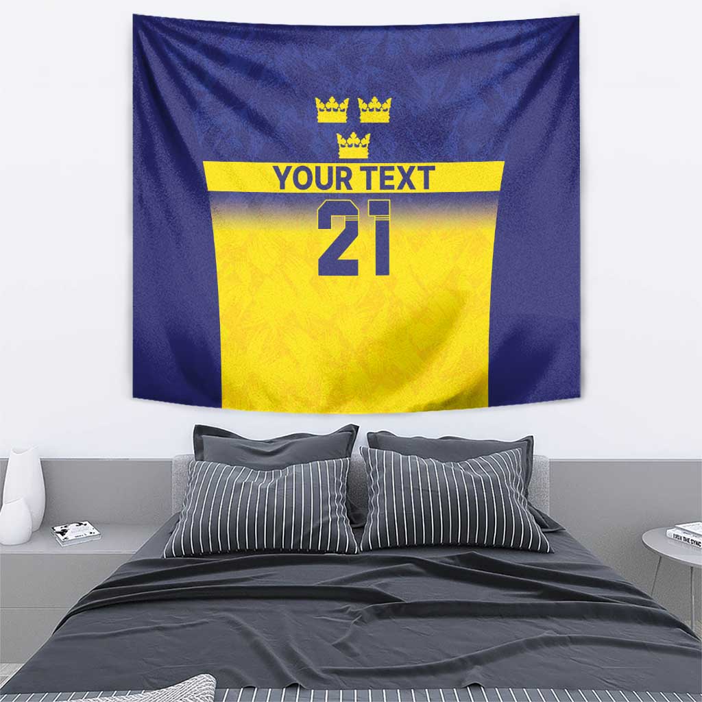 Hanging blue tapestry with yellow center design featuring three crowns, “YOUR TEXT,” 21