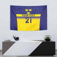 Blue wall tapestry showing three crowns above a yellow panel with “YOUR TEXT” and 21