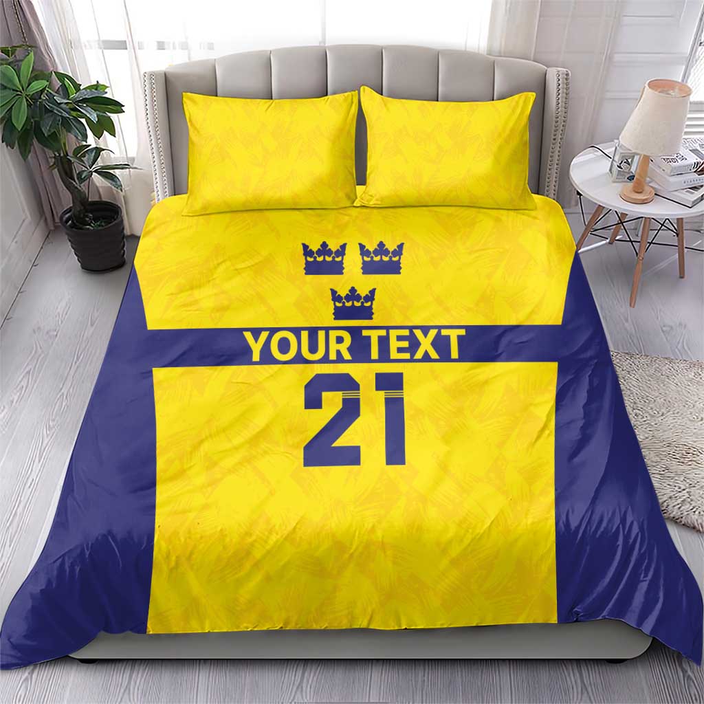 Gold and blue duvet with 2 pillowcases; crown symbols, 'YOUR TEXT', and large '21'.