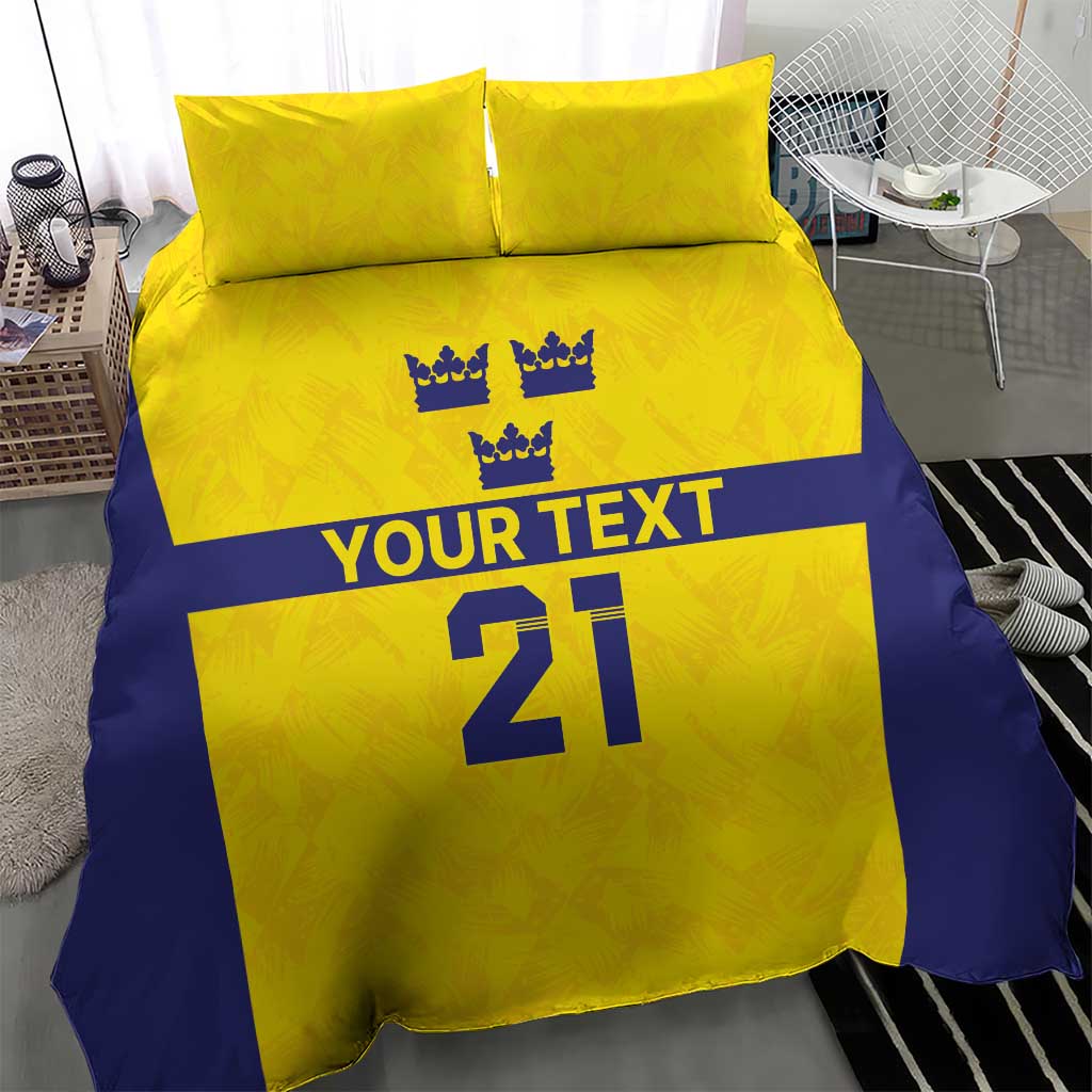 Gold and blue bedding set with 2 pillowcases; crowns, 'YOUR TEXT', and '21' print.