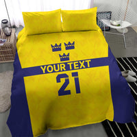 Gold and blue bedding set with 2 pillowcases; crowns, 'YOUR TEXT', and '21' print.
