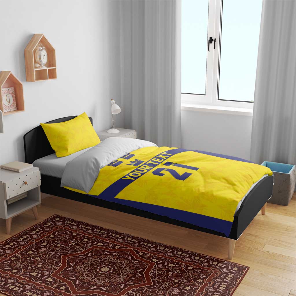 Gold and blue duvet cover with 1 matching pillowcase; crowns, 'YOUR TEXT', '21'.