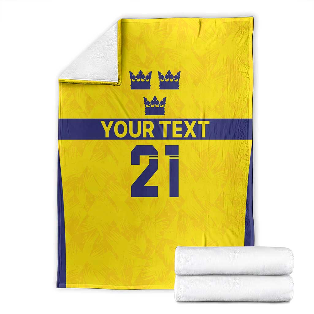 Folded gold rugby blanket with navy edging, crowns, 'YOUR TEXT' and big '21'