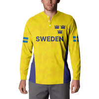 Gold rugby sweatshirt on model, button placket, Sweden logo, crowns, blue diagonal panel