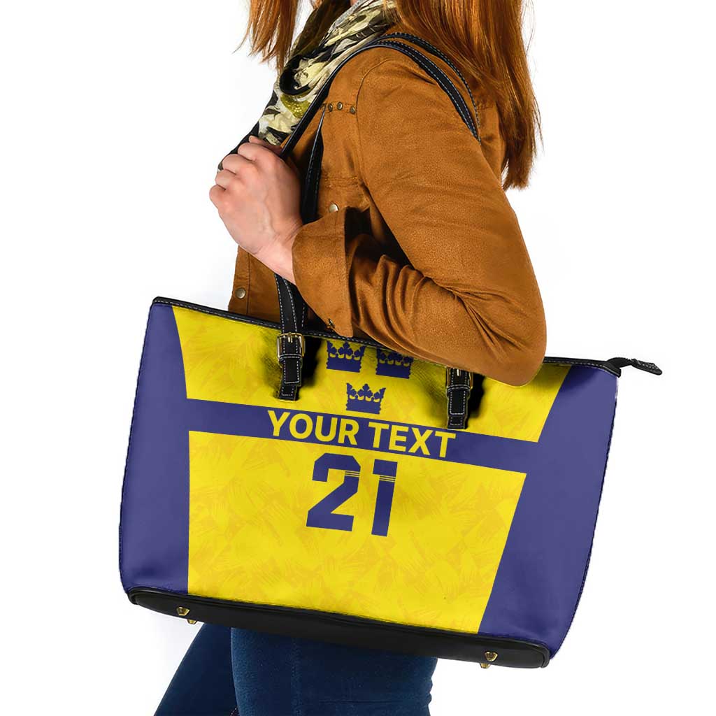 Custom tote bag with yellow and blue front, black handles, zipper top, "Your text 21".
