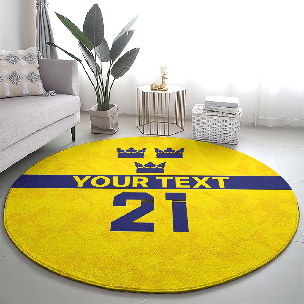 Yellow round rug full view with blue crown icons, 'YOUR TEXT', and large '21'.