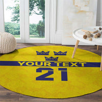 Yellow round rug on floor with blue stripe, crowns row, 'YOUR TEXT', and '21'.