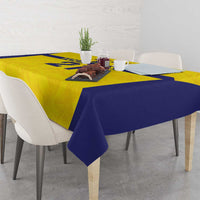 Gold and navy Swedish crown tablecloth spread on dining table and chairs