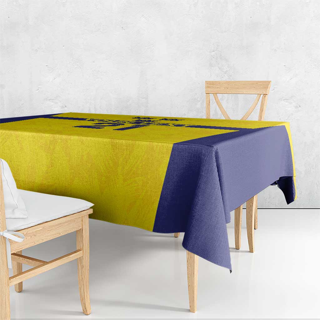 Gold and navy tablecloth with Swedish crown design draped over table edge