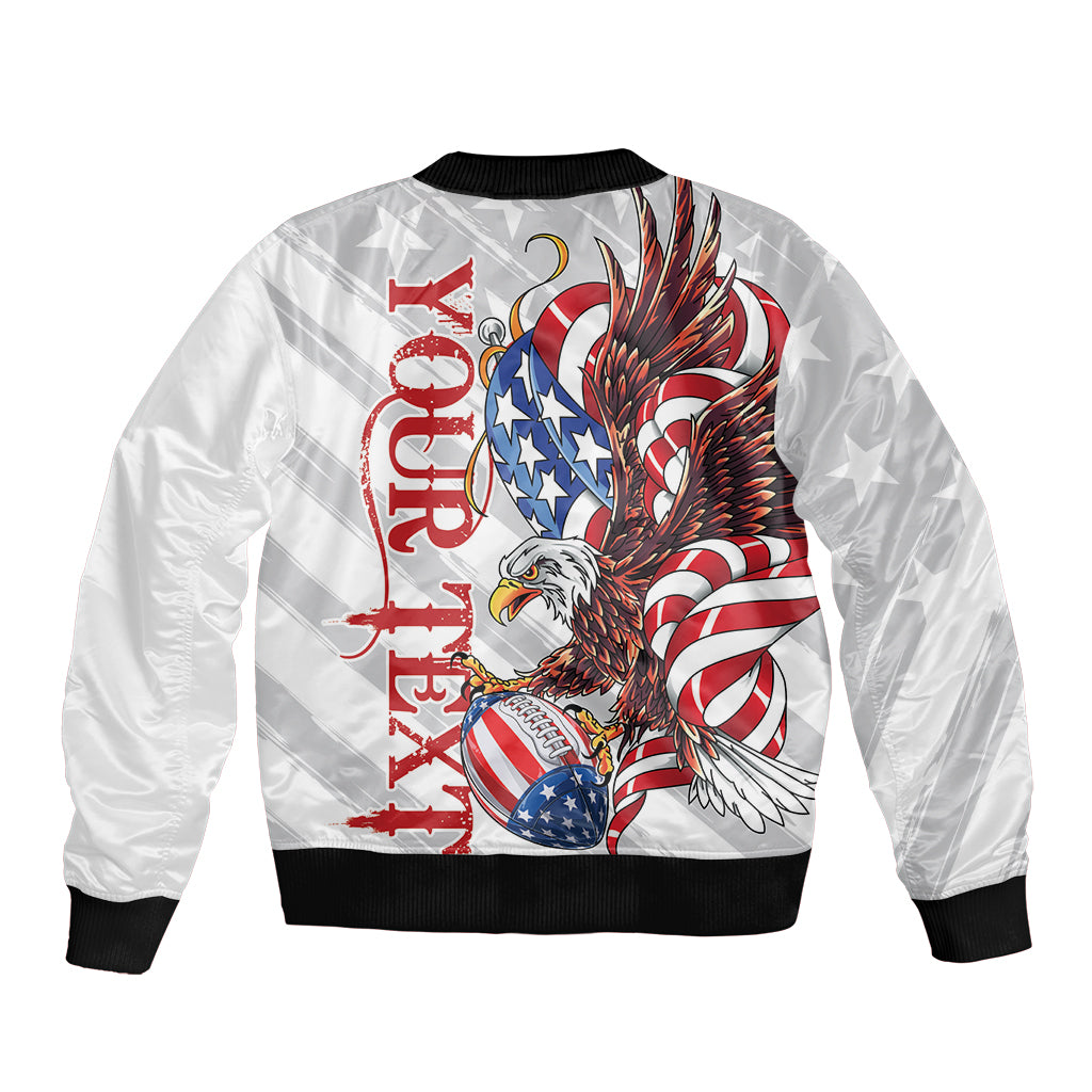 White bomber jacket with front zipper, black ribbed hem, large eagle and flag graphic