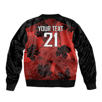 Black bomber jacket with red geometric back print, 'YOUR TEXT' and 21