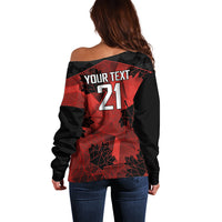Women’s off-shoulder black sweater with red geometric back text 21