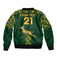 Green unisex bomber jacket back with large 21 print, springbok logo and geometric trim