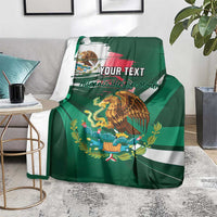 Personalized green blanket on chair with eagle graphic, tricolor stripe, and 'YOUR TEXT'.