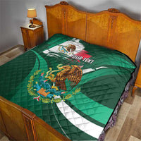 Green quilt on wooden bed with Mexican flag design, eagle graphic, and 'YOUR TEXT'