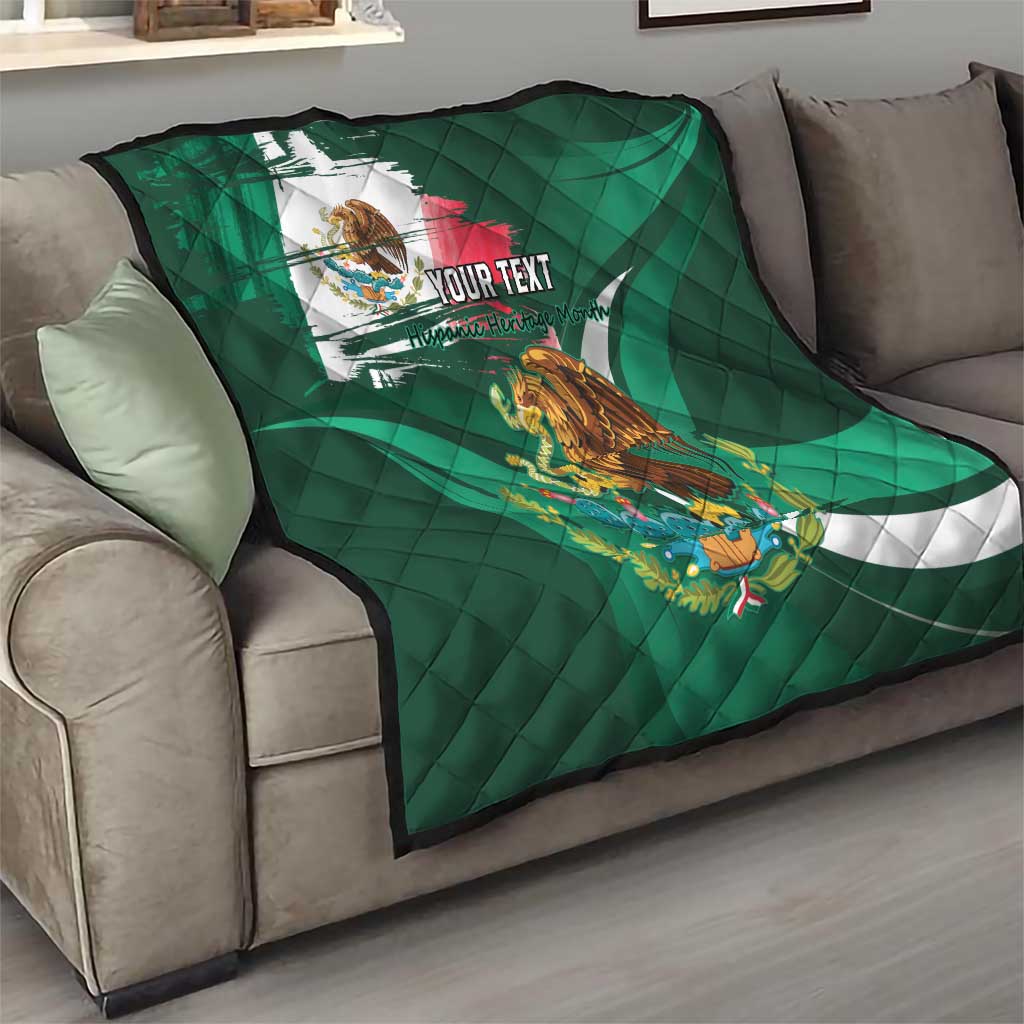 Green Mexican flag quilt with eagle graphic and 'YOUR TEXT', laid on gray sofa