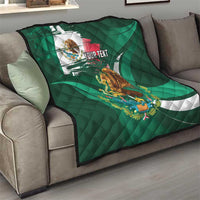 Green Mexican flag quilt with eagle graphic and 'YOUR TEXT', laid on gray sofa