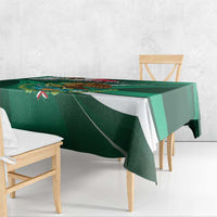 Green tablecloth with white and striped panel design and small colorful patriotic accents.