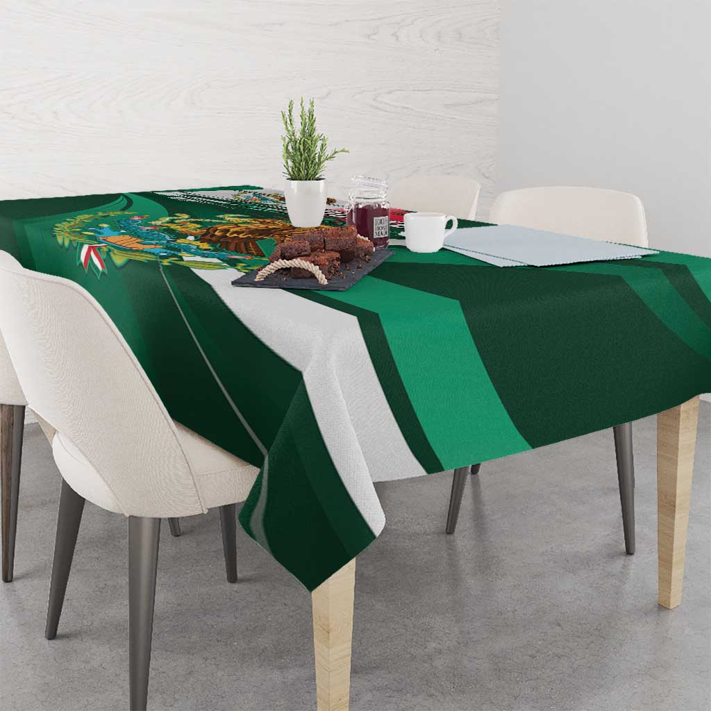 Green tablecloth with decorative eagle illustration and bold diagonal stripe pattern.