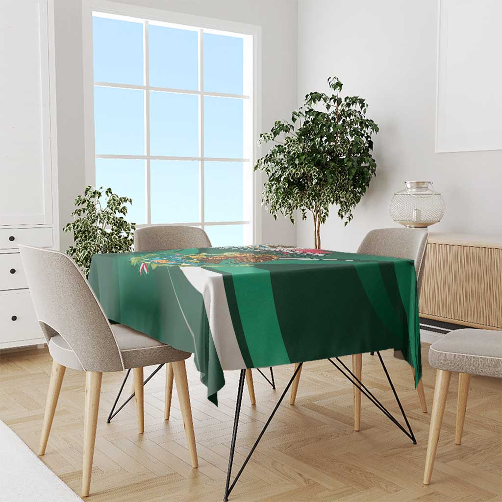Green tablecloth draped on dining table with eagle artwork and diagonal stripe accents.